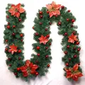 Detail view of a 2.7m Christmas garland with red poinsettias and gold ornaments - Premium Decorated Style / Red