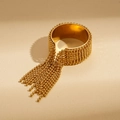 Detail of bohemian gold beaded open bangle with tiered metal chain tassels - Gold