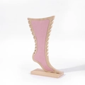 Bamboo and pink velvet necklace display stand with foot-shaped silhouette on white backdrop - Pink