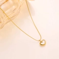 Close-up of golden titanium steel heart necklace with white shell inlay and O-chain - XL8078J Mother of Pearl Heart Necklace Gold