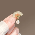 Golden fan-shaped alloy brooch with sparkling crystals and a dangling pearl drop charm - 469# Fan
