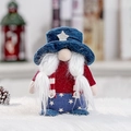 Patriotic gnome plush with blue star hat and red striped overalls on white fur background - Blue Hat Style