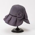 Elegant mauve sun hat with breathable knit top and large bow detail on a vintage metal stand - M (56-58cm) / Purple