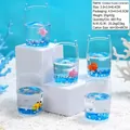 Presse-papiers marin en acrylique avec figurines de dauphins et liquide bleu - Mini Seau - Animaux Marins / Styles Aléatoires