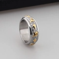 Two-tone gold and silver rotatable stainless steel ring with embossed mantra symbols - Six-Syllable Mantra Scrolling Foliage Style (KR39488-OT)
