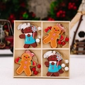Vierteiliges Set aus hölzernen Lebkuchenmann-Anhängern in einer Holz-Geschenkbox - Lebkuchenmann Stil C