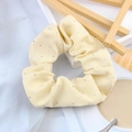 Detail shot of yellow elastic hair scrunchie with rhinestones on a lifestyle background - Light Yellow
