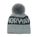 Detailed close-up of grey knit beanie with Norway text and a fluffy faux fur pompom - M (56-58cm) / Gray