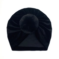 Detailed view of black velvet baby hat with a soft pompom and pleated texture - One Size / Black