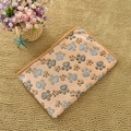 Orange flannel pet blanket with colorful paw prints and soft fleece texture - Coffee Paw