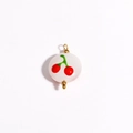 Close-up of white ceramic charm with red cherry print and 18K gold-plated metal parts - Red Cherry Round Flat (Style 5)