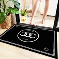 Absorbent anti-slip bathroom mat in black with white logo design in a home setting - Black Logo Print 404