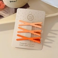 Three-piece set of orange gradient resin hair clips on a handmade designer paper card - Orange Gradient Cross Set
