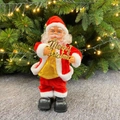 Elektrischer Weihnachtsmann mit goldenem Merry Christmas Schild und Goldweste - Weihnachtsmann mit Merry Xmas Schild
