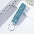 Detail of light blue rhinestone pill bottle keychain with 3-section modular design - Lake Blue