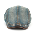 Dettaglio cappello newsboy in denim lavato con cuciture arancioni e bordo visiera in pelle - Regolabile / Blu Medio