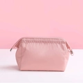 Portable pink nylon waterproof makeup bag with secure zipper and drawstring closure - Light Pink