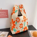 Macro shot of knitted tote bag showing orange floral texture and premium woven cotton - Orange Sunflower
