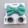 Detail of baby daisy sunglasses and mesh bow headband set on display card - Cyan
