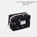 Quilted black makeup bag with pink polka dots and bows, size 17x10x11cm, lightweight design - Black Pillow Bag