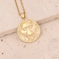 Detailed close-up of a 18K gold-plated zodiac necklace with lion relief on stone background - 4#Taurus