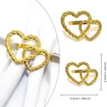 Rond de serviette doré à double cœur avec texture tissée élégante pour décor de mariage - Double cœur entrelacé doré