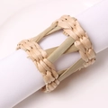 Macro detail of natural woven straw napkin ring texture on white linen cloth - Hollow Bamboo Woven