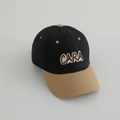 Detailed close-up of a two-tone baseball cap with CARA embroidery and neat stitching - 52-54cm (3-8 Years) / Black (CARA)