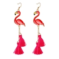 Elegant gold earrings with pink flamingo charms and bright red layered tassel dangles - Flamingo Tassel