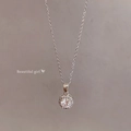 Elegant silver pearl necklace with a circular pendant featuring a brilliant center stone - X1853 Silver - Round Cluster