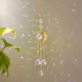 Golden moon suncatcher with crystal prisms creating rainbow light on minimalist wall - Large Moon Pendant / Gold