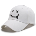 White cotton baseball cap featuring black embroidered smiley face with tongue out design - Adjustable / White