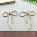 Golden textured bow-shaped metal earring pendant with measurement scale on white background - Long Rope Texture Bowknot - KC Gold (21396)