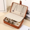 Detail of brown PU leather jewelry box featuring necklace hooks and inner ring slots - 16*11*5cm / Brown