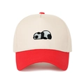 Close-up of a panda embroidery on a two-tone trucker hat with cream canvas and red brim - Adjustable / Red
