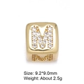Macro shot of 8mm gold letter M charm with pavé cubic zirconia for DIY jewelry - Letter M