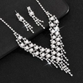 Elegant silver bridal jewelry set with white pearls and sparkling zircons on black background - Pearl Necklace And Earrings Style (465)
