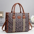 Elegant tote bag with cherry print and faux leather finish on indoor decor background - Cherry Print / Black