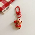 Close-up of cute brown capybara keychain wearing red jersey with number 11 and sports ball - Capybara - Basketball