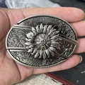 Detailed relief of a sunflower on a vintage antique silver metal belt buckle - Daisy