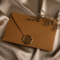 Close-up of vintage brown textured envelope with For You wax seal on gold silk - 1pc Linen Coffee Envelope + Wax Seal / Coffee