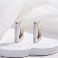Macro shot of silver S925 sterling silver U-shaped earrings with zircon inlay and hallmark - White K Large Size / 16.5*20.2mm