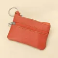 Mini orange pebbled leather coin purse with double zipper compartments and key ring - Orange