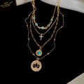 Gold multi-layer necklace with bohemian charms like cross, turquoise bead, and lotus disk - Multi-layer Layered Bohemian Style (With Cross/Lotus/Turquoise) / Gold