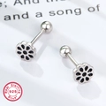 Detail view of 925 sterling silver daisy earrings with black enamel and screw back ball - Silver Black