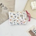 Quilted floral makeup bag with cute puppy print and pink strap in aesthetic setting - Latte Blue Dog
