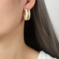 French vintage C-shaped hoop earrings with cream enamel and textured gold finish - Off White