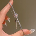 Macro shot of silver zircon flower bracelet with adjustable slide clasp on a model - Silver