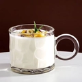 Textured transparent glass mug with handle containing yogurt and granola topping - Clear Raindrop Pattern Mug