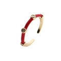 Detailed macro of gold-plated bamboo ring with red enamel and sparkling zircons - Adjustable Open / Red